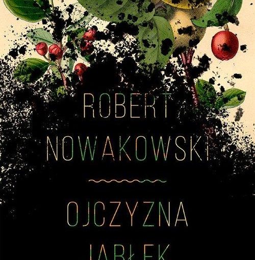 okładka książki, u góry gałązka z jabłkami, pod nią czarna ziemia a na niej napis Robert Nowakowski, Ojczyzna jabłek