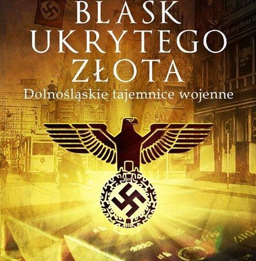 okładka książki, godło Trzeciej Rzeszy przedstawiające czarnego orła trzymającego w szponach wieniec, wewnątrz którego znajduje się swastyka, w tle sztabki złota, tramwaj, kamienica, od góry napis: Leszek Adamczewski, Blask ukrytego złota, Dolnośląskie tajemnice wojenne